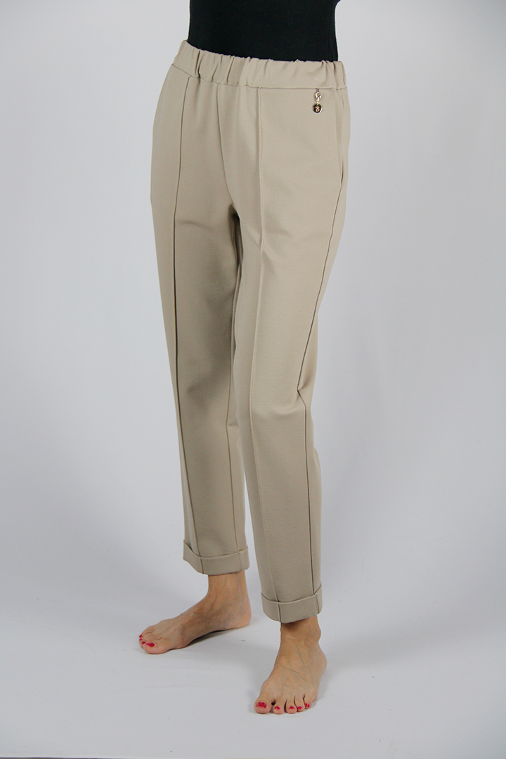 Pantalone colore avorio in tessuto elasticizzato con elastico in vita